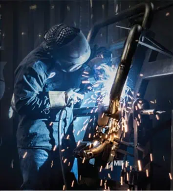 Ex-Guard welder working on a grille guard assembly