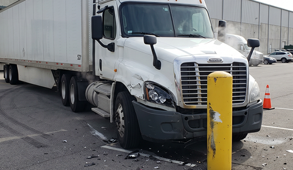 Semi truck positioned near fixed objects in a yard